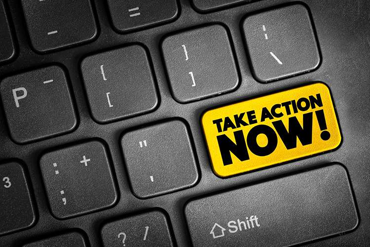 Keyboard with "Take Action Now" call-to-action button emphasizing photo backup solutions
